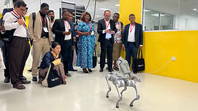 Programme participants captivated by the remote-controlled devices that were programmed to perform various tasks.
