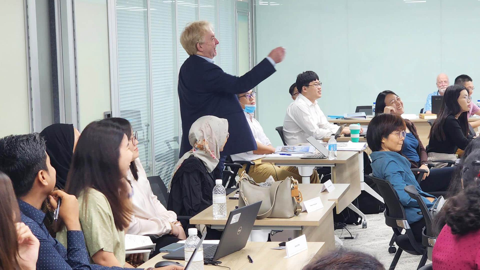 Tutors offering expert feedback and sharing their perspectives on group work exercises, helping participants refine their approach to patent drafting
